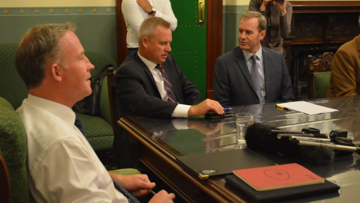 Deputy Premier Jeremy Rockliff and Michael Ferguson talk before the PLP's first meeting.