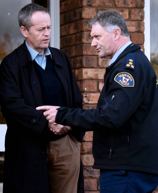 JOB WELL DONE: Opposition Leader Bill Shorten meets
Northern Police Commander Brett Smith at the SES headquarters in Youngtown. Picture: Neil Richardson