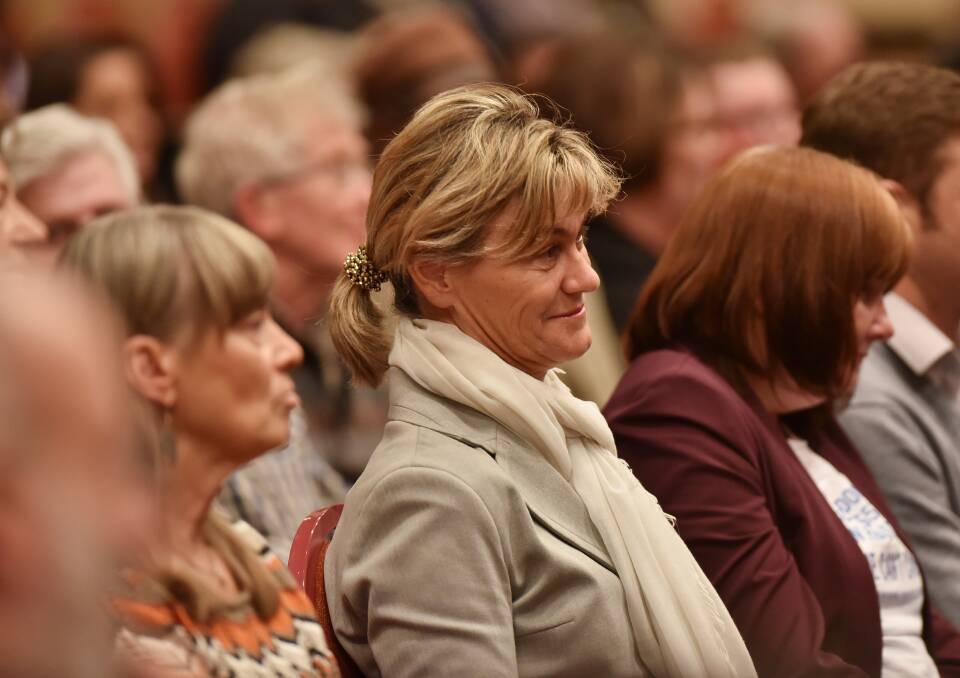 Australian Nurses and Midwifery Federation secretary Neroli Ellis listens to the candidates talk about health funding.