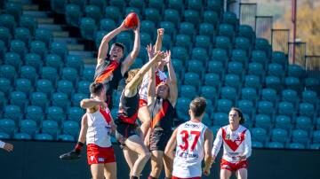 North Launceston's Jack Aherne rises above a pack to take a mark. Picture by Paul Scambler