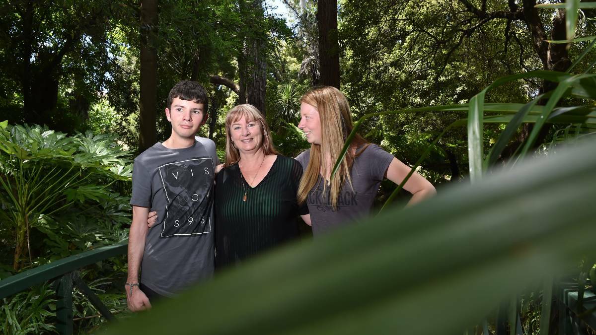 HOPEFUL: Aaron and Taylor Adams with their mother, Kellie. The Kangaroo Flat siblings are first in Australia to trial a drug intended to help people with a rare disease. Pictures: NONI HYETT