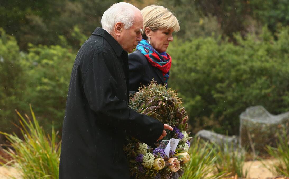 Paying respect: Former Prime Minister John Howard and Foreign Minister Julie Bishop lay a wreath at the commemoration of the Port Arthur massacre. Mr Howard received praise for his gun reforms. Picture: Getty Images