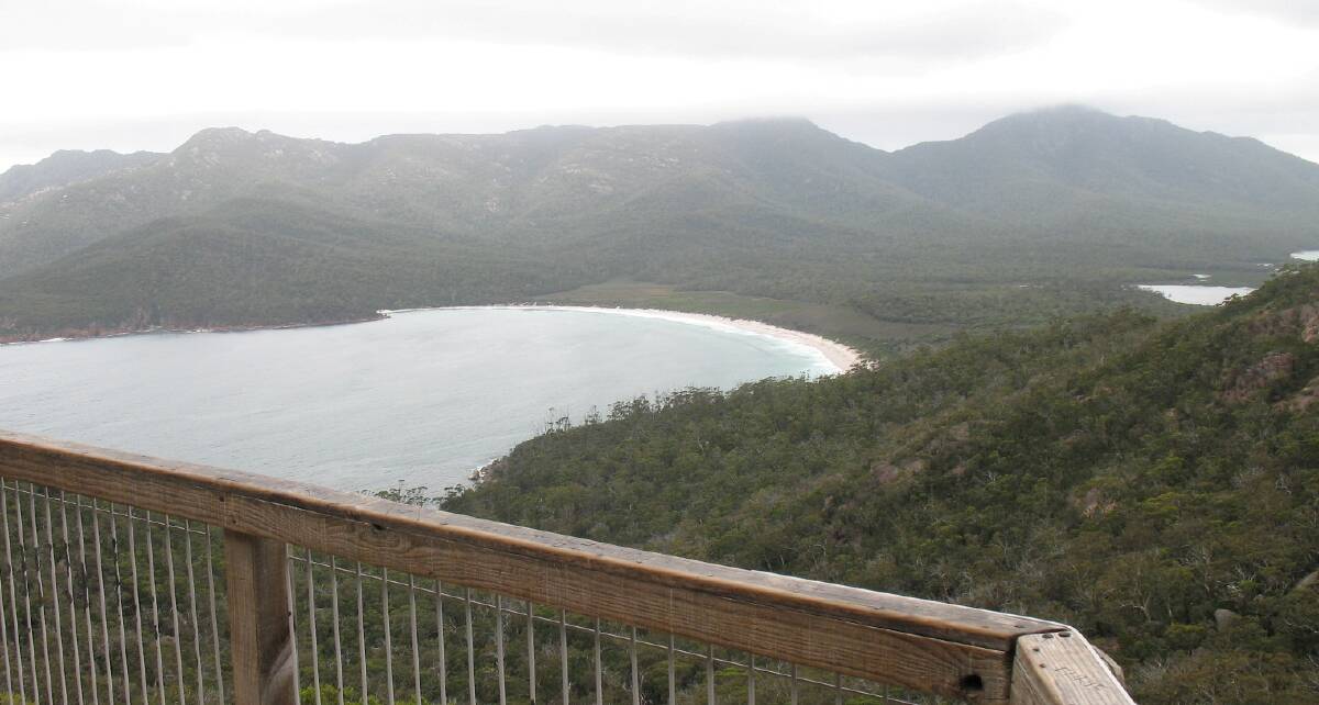 FREYCINET: People flock from around the globe to view the natural beauty of sweeping wineglass bay, as seen here from the saddle lookout. Picture: David Scott