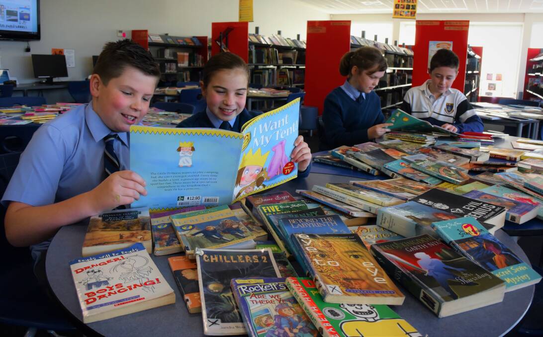 READAHOLICS: Grade 4 students Jack Reader, Ava Schiliro, Yasmin Wyly and grade 5 student Lachie Snell taking part in the Great Book Swap to raise money for the Indigenous Literacy Foundation. Picture: Piia Wirsu