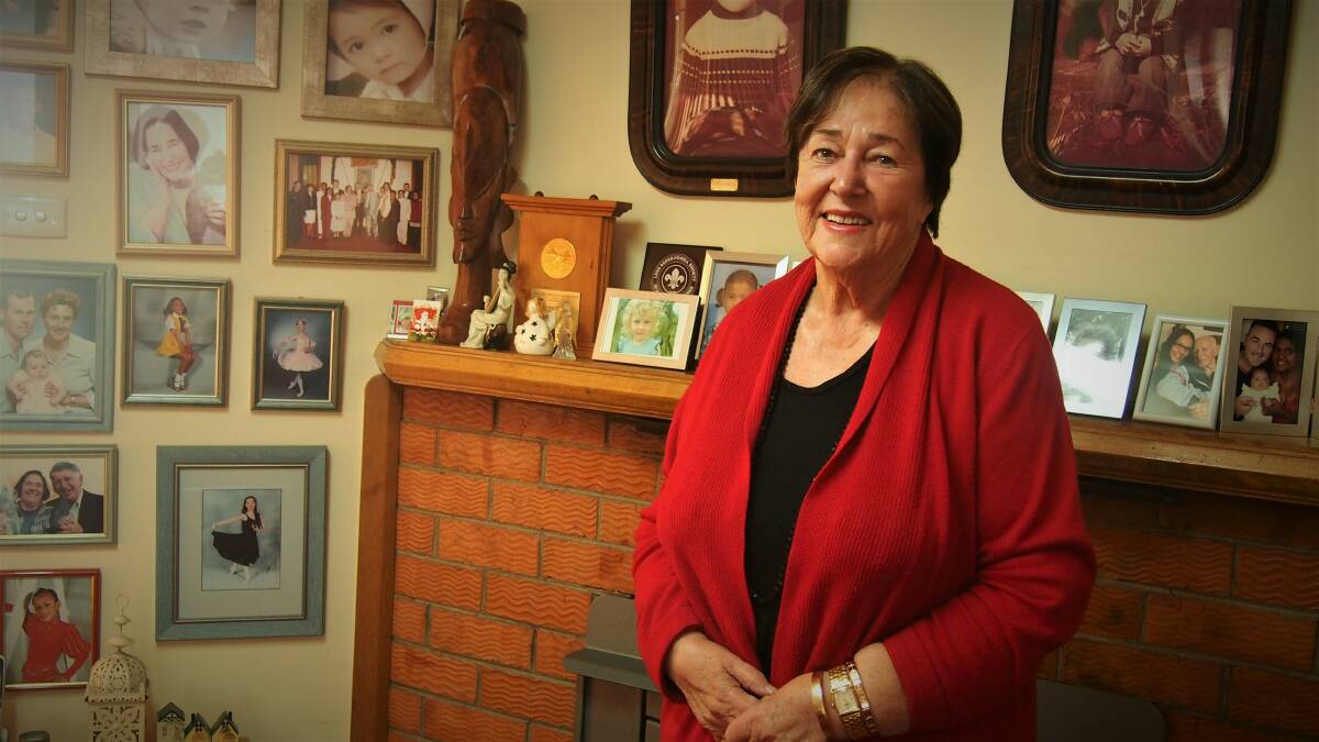 PIONEER: Pat Howard surrounded by photos of her large family. Picture: Piia Wirsu