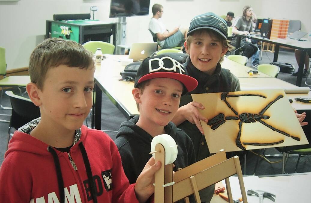 BRIGHT SPARK: Jonathon Harback, Jasper Wolfe and William Cook have created a miniature hydroelectric power system in the Recharge program this week, learning new skills and meeting friends along the way. Picture: Piia Wirsu