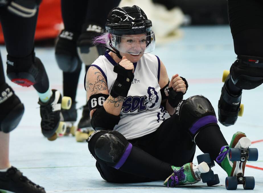 IN THE GAME: Devil State Derby League's T~Wrecksy holds tight after falling during the game against Geelong Roller Derby League at a round robin competition on Saturday. Picture: Scott Gelston