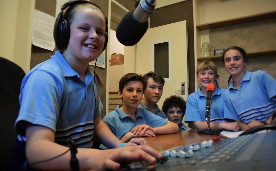 ON THE MIC: St Thomas More's students Brianna Bunton, Bailey Fulton, William Ferrall, Harry Coltrane, Abbey Limbrick and Grace LeFevre broadcasting for Schools Out. Picture: Piia Wirsu