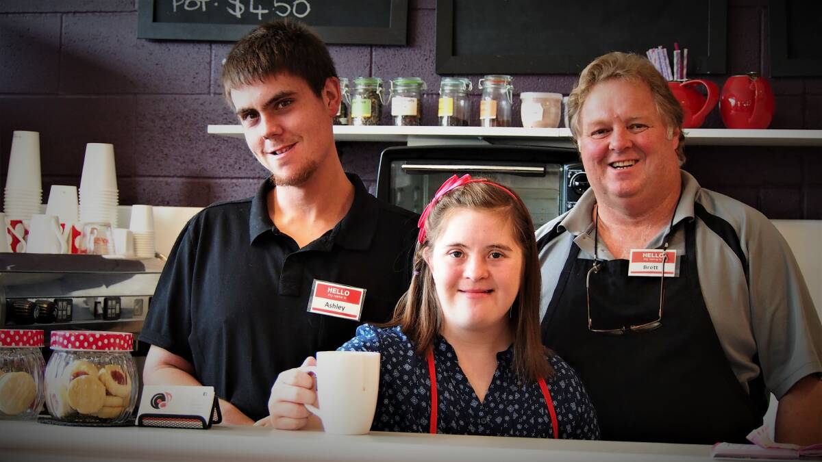 AT WORK: Cafe Next Door workers Ashley Smith and Chloe Hansson learning on the job with cafe owner Brett Mitchell. Picture: Piia Wirsu