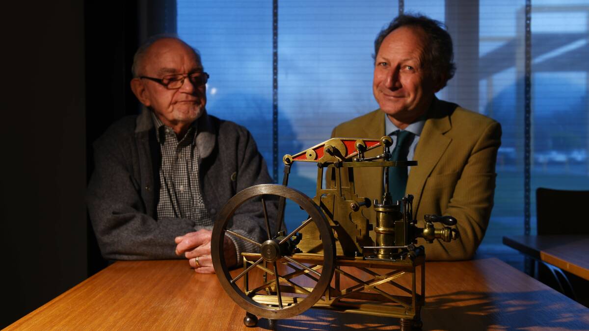PIECE OF HISTORY: A unique model steam engine from 1864, one of only two in the world, has been donated to the QVMAG by Geoff Smedley, here with QVMAG Director Richard Mulvaney. Picture: Scott Gelston