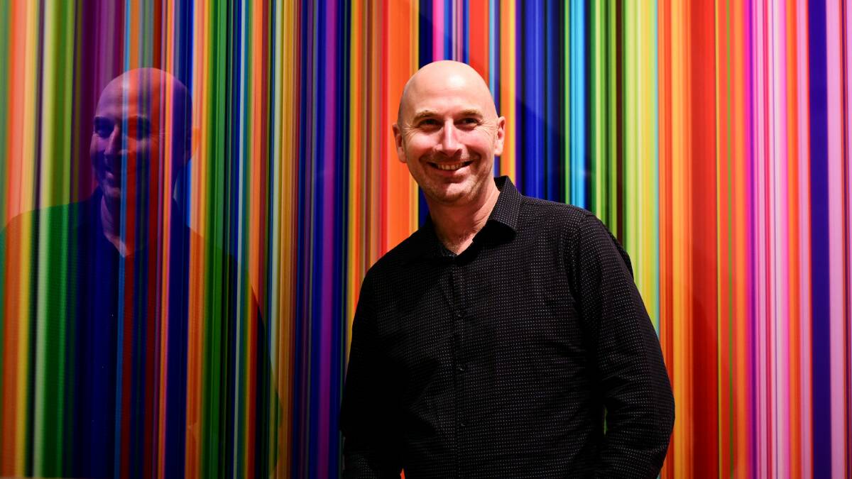 COLOUR: Tasmanian artist Paul Snell with a work from his exhibition, The Liminal Space, on at the QVMAG until October 8. Picture: Neil Richardson
