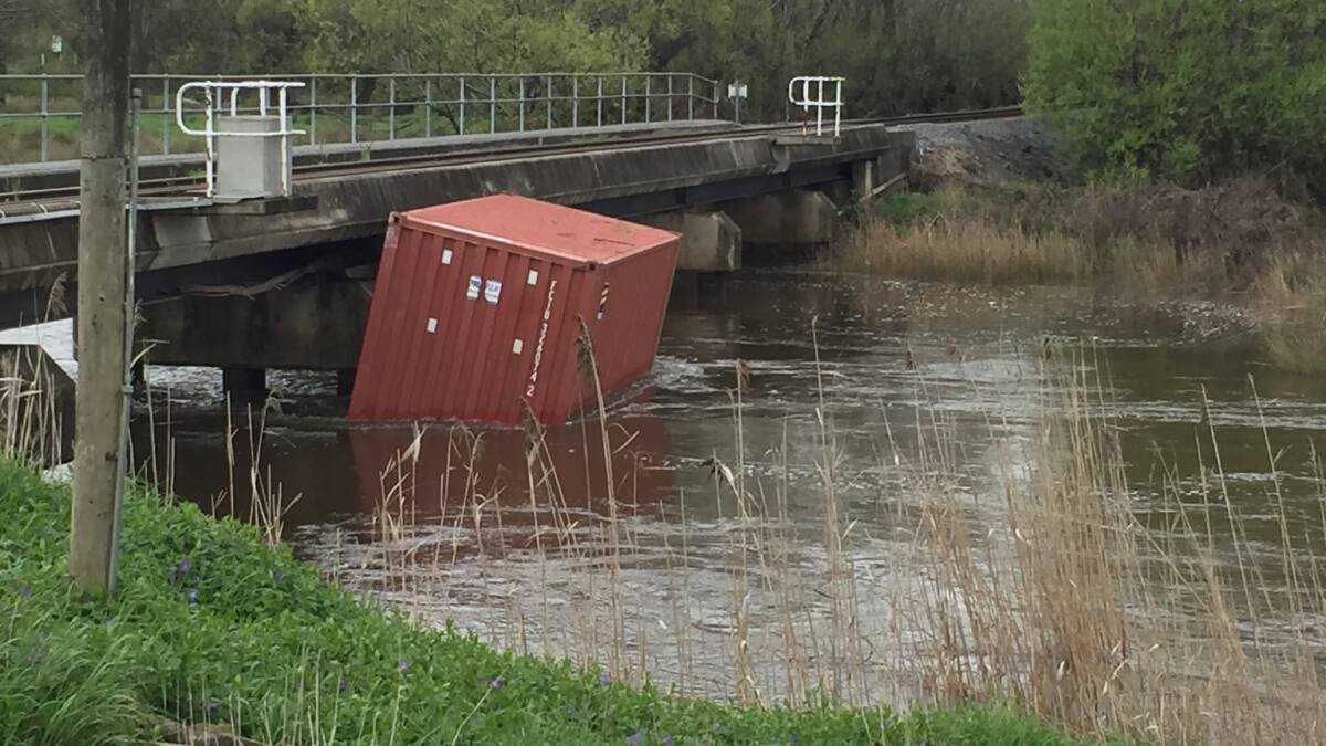 Shipping container seen floating downstream