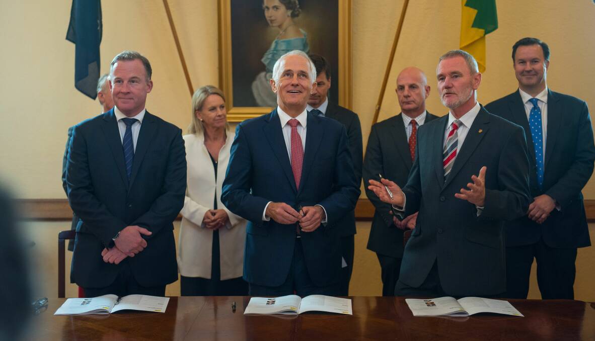 DEAL SIGNED: Premier Will Hodgman, Prime Minister Malcolm Turnbull and Launceston mayor Albert van Zetten. Picture: Scott Gelston