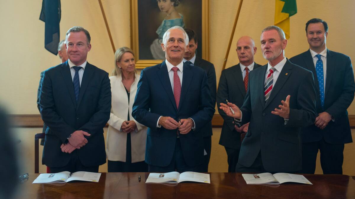 DEAL SIGNED: Premier Will Hodgman, Prime Minister Malcolm Turnbull and Launceston mayor Albert van Zetten sign the City Deal. Picture: Scott Gelston