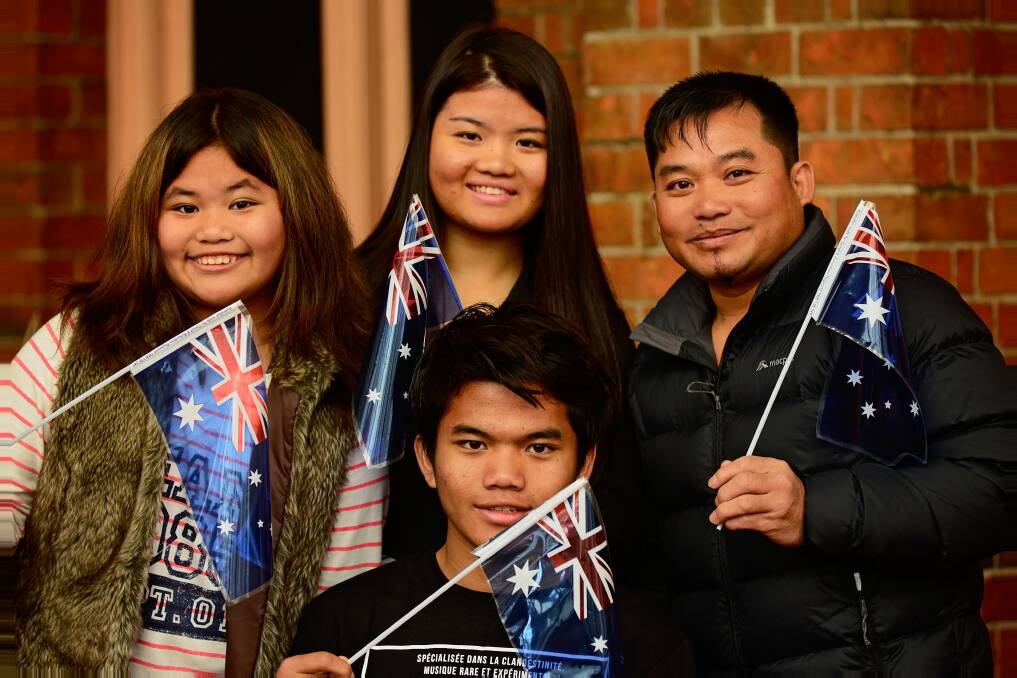 NEW CITIZENS: The Hringngen family, Reuben, 15, Melody, 12, Rosy, 17, and their father David.