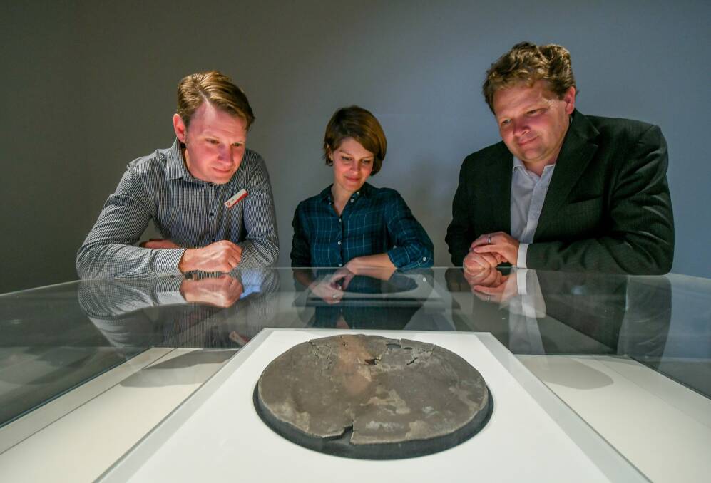 UNIQUE: QVMAG's Jon Addison, Rijksmuseum's Tamar Davidowitz and QVMAG's David Thurrowgood with Dirk Hartog's plate. Picture: Phillip Biggs