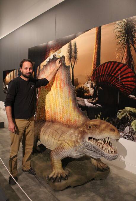 PERMIAN STYLE: QVMAG exhibitions manager Andrew Johnson amongst the Permian monsters exhibition. Photo: Holly Monery 