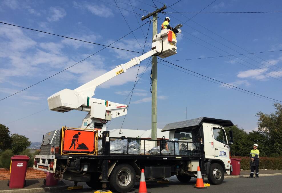 IN ACTION: One of three teams across Launceston installing the new LED street lighting. Each crew can change about 50 lights each day. Picture: Holly Monery