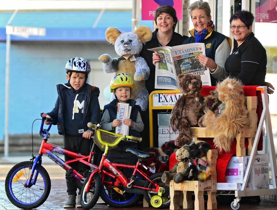 GET READY: Newsagent owner Sue Sherriff, George Town Rotary Club past president Helen Green and Julie Lynch, with Oliver and Wilba Green. Picture: Phillip Biggs.