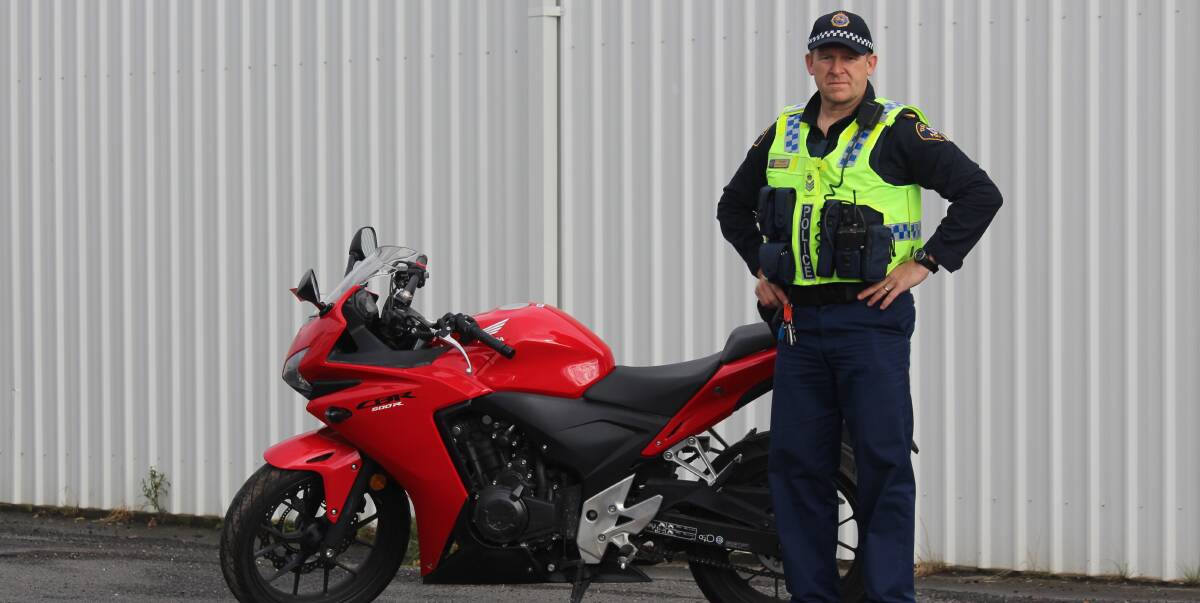 EXCESSIVE SPEEDER CAUGHT: Senior Sergeant Jason Jones with a Honda CBR 500R, which has been impounded for 28 days after the rider was clocked at 96km/h in a 50km/h zone. Picture: Holly Monery.