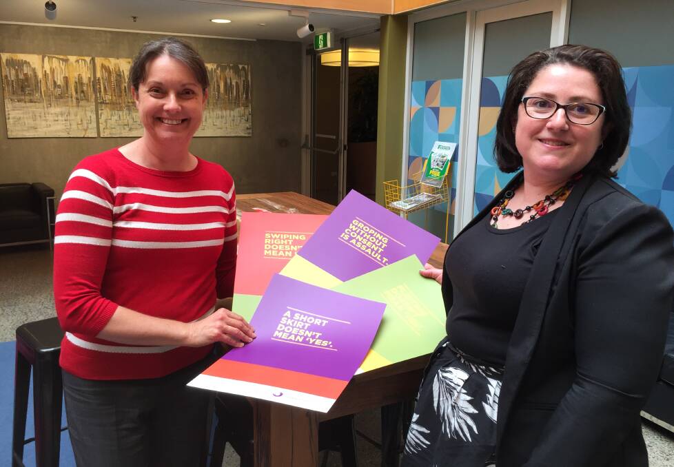 ATTITUDE CHANGE: The Sexual Assault Support Service chief executive Jill Maxwell and Laurel House service manager Fiona Girkin, with some of the posters which will be located at pubs and clubs across Tasmania.