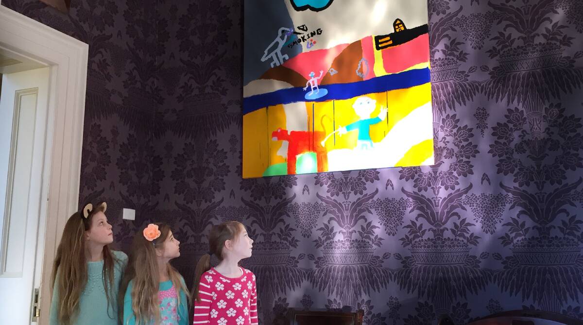 NEW ART: Holly Brennan, Mhairi McOwan and Charlotte Neville, all 8, admire an artwork by Alan Young which will adorn Clarendon's walls for a month.