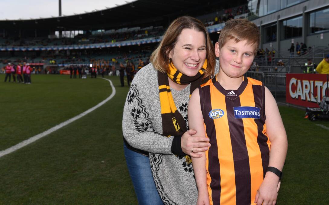 MATCH DAY: Nicholas Geeves, 9, of Hobart with his mother Tracy Geeves. Nicholas took to the field with Hawthorn. Pictures: Scott Gelston.