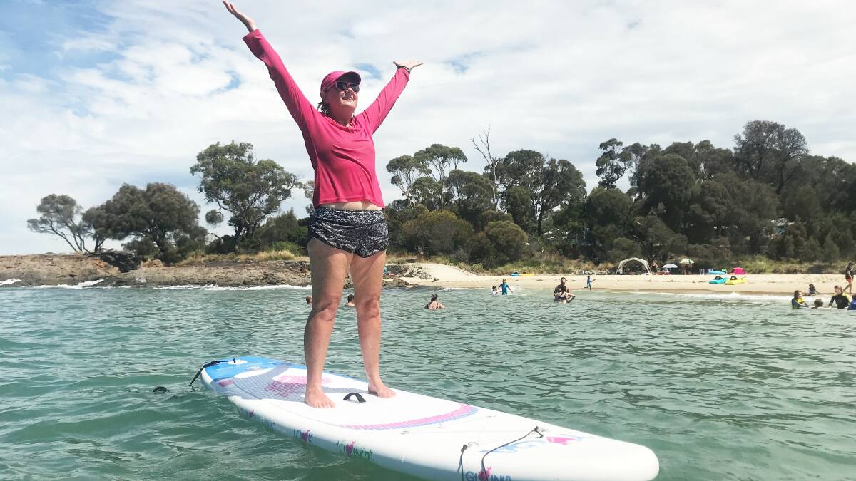 BALANCE: Jen Barron teaches stand-up paddleboard yoga. Picture: Supplied 