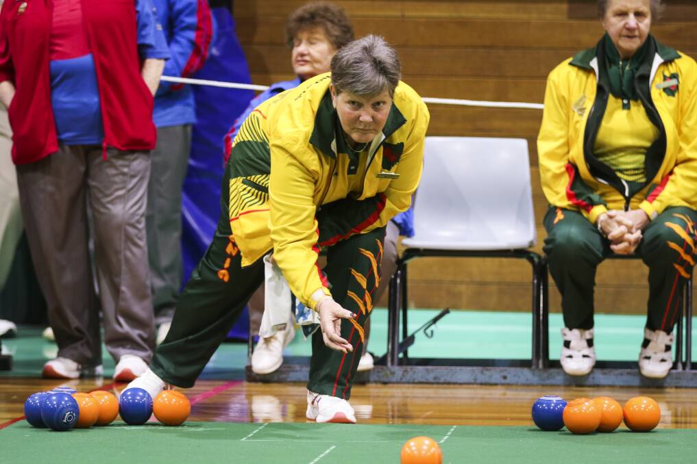 Rolling along: Hobart's Cheryl Culliford watches her delivery during Thursday play at the Australian Indoor Bias Bowls National Championships. Picture: Cordell Richardson.