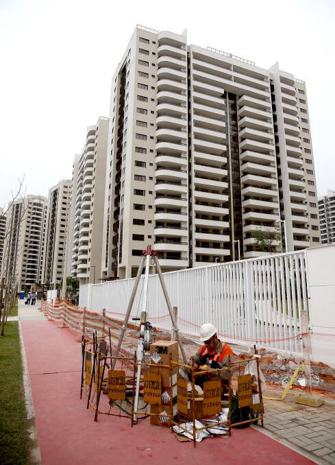 Better late than never: Work goes on around the Olympic village in Rio despite the games commencing on August 5. Picture: Getty Images.