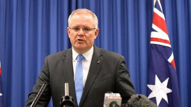 Treasurer Scott Morrison is widely expected to follow through with a final decision on the Ausgrid sale this week. Photo: Bradley Kanaris
