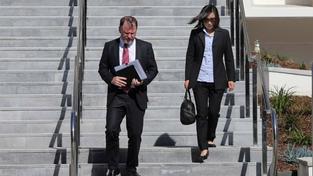 Big Fat Smile CEO Bill Feld and Len Zhang, former director of the company's Bellambi Point centre, Lan Zhang, depart Wollongong Court House. Picture: Robert Peet