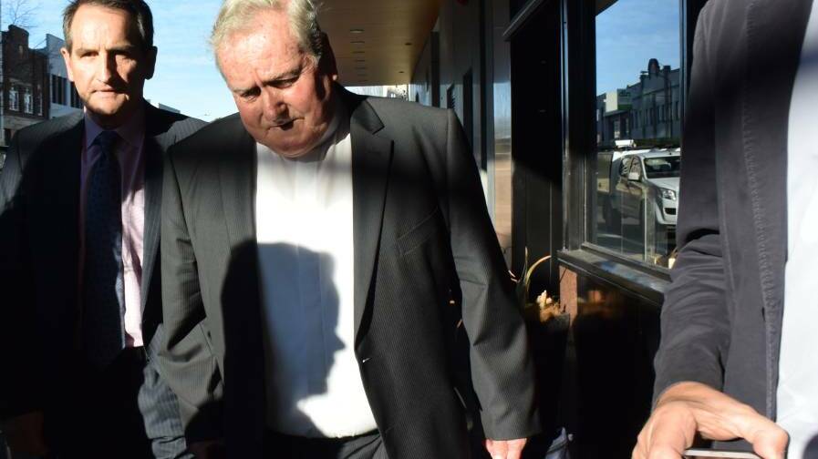 Bishop Michael Malone leaves Newcastle Courthouse on Thursday after giving evidence.