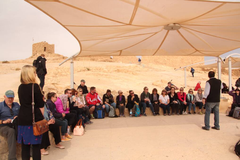 GREAT OUTDOORS: A group lecture at Masada.