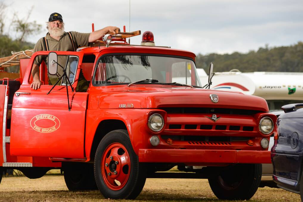I SEE RED: Pyengana Easter Carnival organiser Vaughan Oldham steps inside a 1955 F500 firetruck. The truck was exhibited as part of the carnival's show and shine display. Pictures: Phillip Biggs 