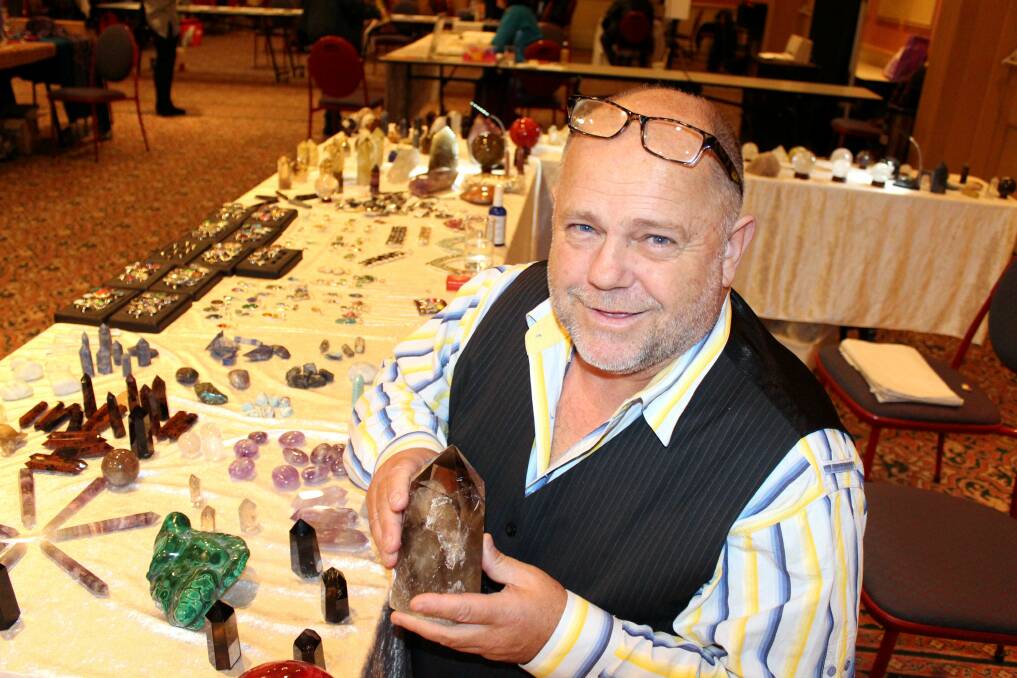 EXPO: Stallholder Mahrcus Robinson shows off some smoky quartz at the Launceston Psychic Expo at Hotel Grand Chancellor. Picture: Hamish Geale