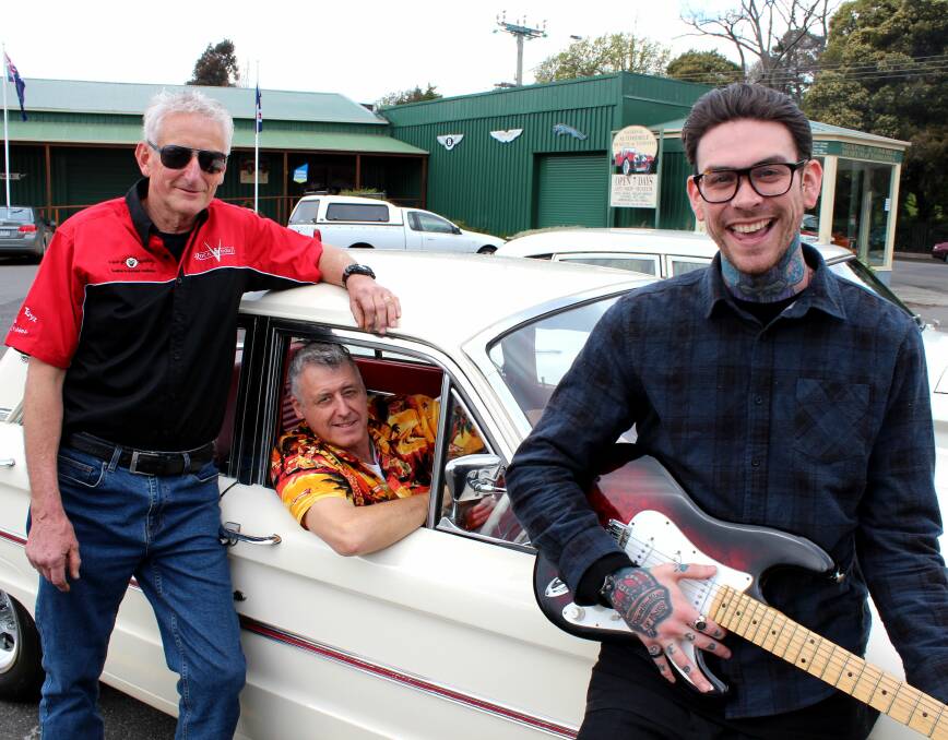 FORD AND FENDER: Rock and Rodz committee member Phil Hollingsworth, event coordinator David O'Keefe and Launceston musician Matthew Garwood take a closer look at a 1963 Ford Falcon Futura. Picture: Hamish Geale