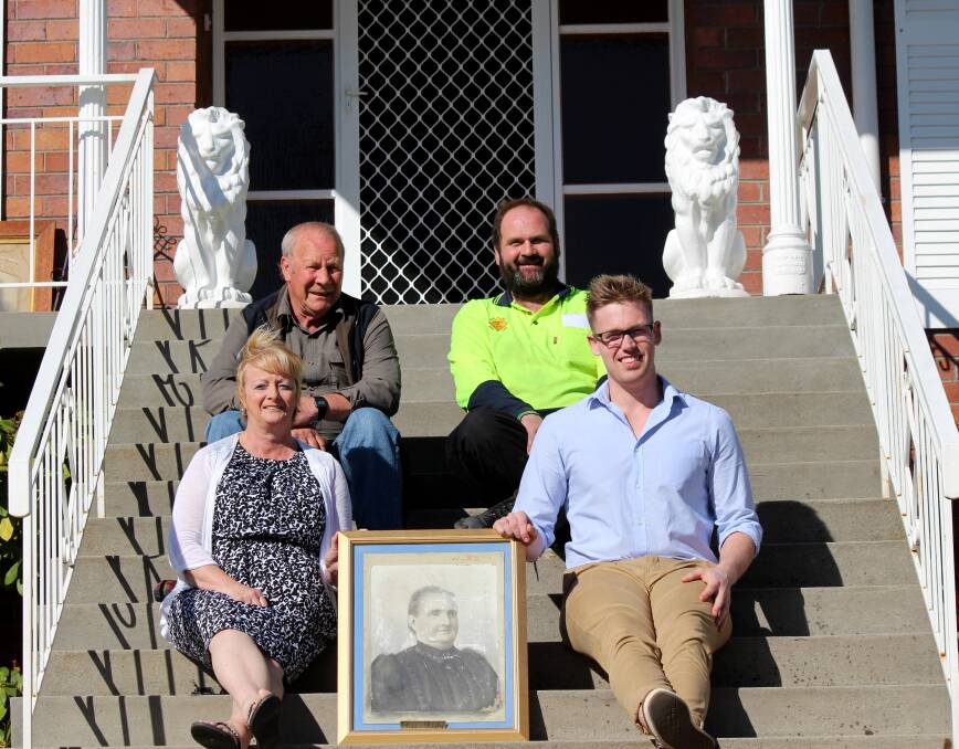 FAMILY TIES: Reg Rigby, Michael Rigby, Sheila Miller and Luke Rigby with a picture of descendant Eliza Rowbothan. The group are hoping more Rigby history can be unveiled at an upcoming family reunion. Picture: Hamish Geale 