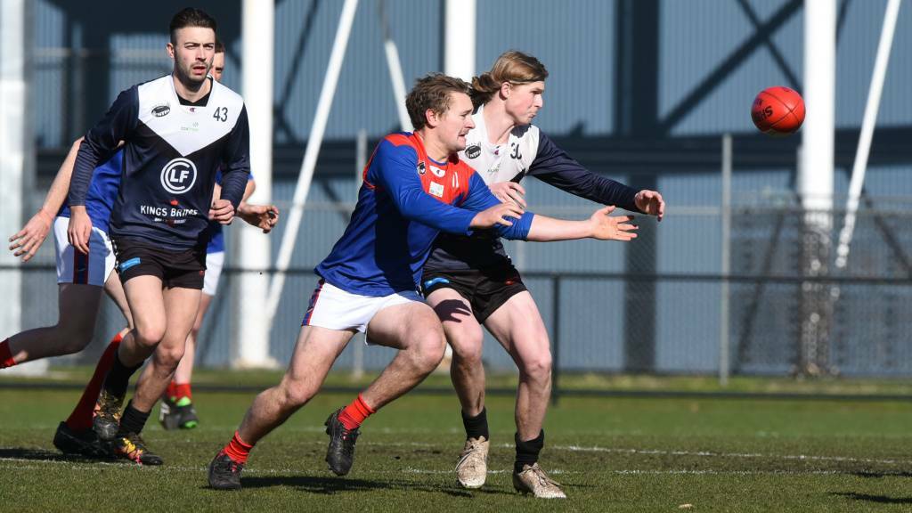 FIFTY-FIFTY: Lilydale's Wil Lockhart and Blue Campbell Fraser fight for possession. Picture: Neil Richardson 