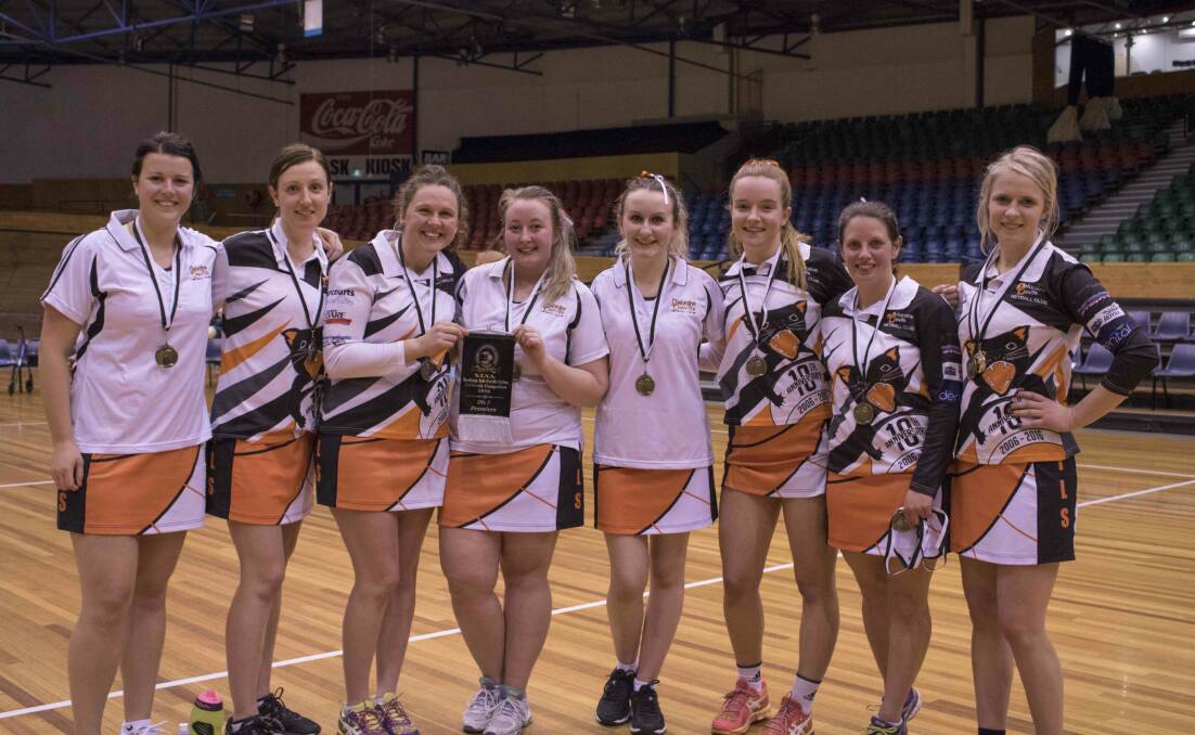 SWEET SUCCESS: Deloraine Devils' division 5 team players Charlotte How, Vanessa Gibson, Louise Hanson, coach Teegan Philpott, Morgan Goninon, Amy Groves, Natasha Whiteley and Reanna Bowman. Picture: Supplied