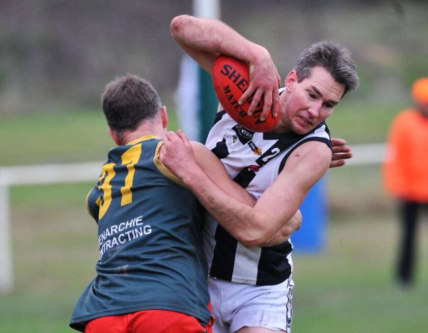 BLACK AND WHITE: Scottsdale stalwart Damian Brown brought up his 200th match in the  Magpies' season opener against Rocherlea. The ruckman has scarcely missed a game since joining from the Crows in 2004. 