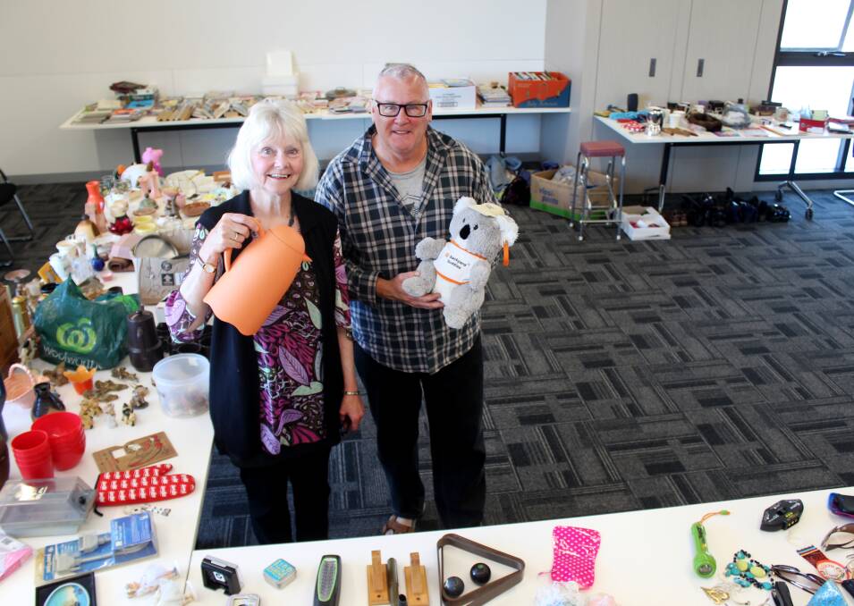 PASS IT AROUND: Herrick's Alison Conroy-Jones and pop-up swap meet facilitator Steve Colwell take a look at items up for grabs at Scottsdale's swap meet. Picture: Hamish Geale 
