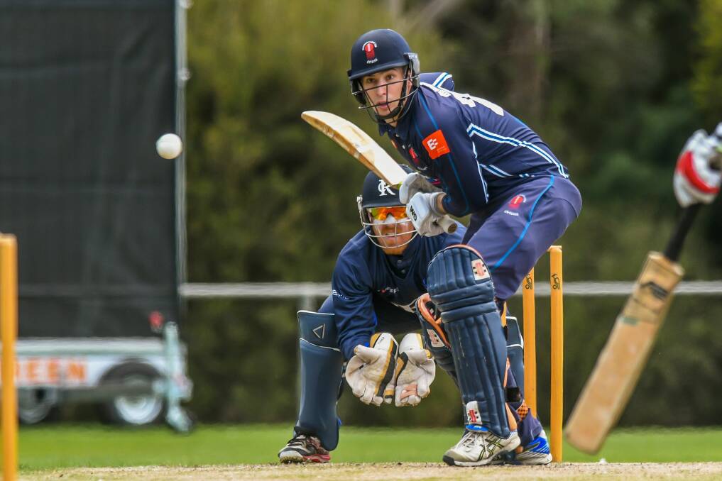 FOCUS: Devonport batsman Miles Barnard keeps his eye on the ball as Riverside keeper Peter New crouches low. Picture: Phillip Biggs