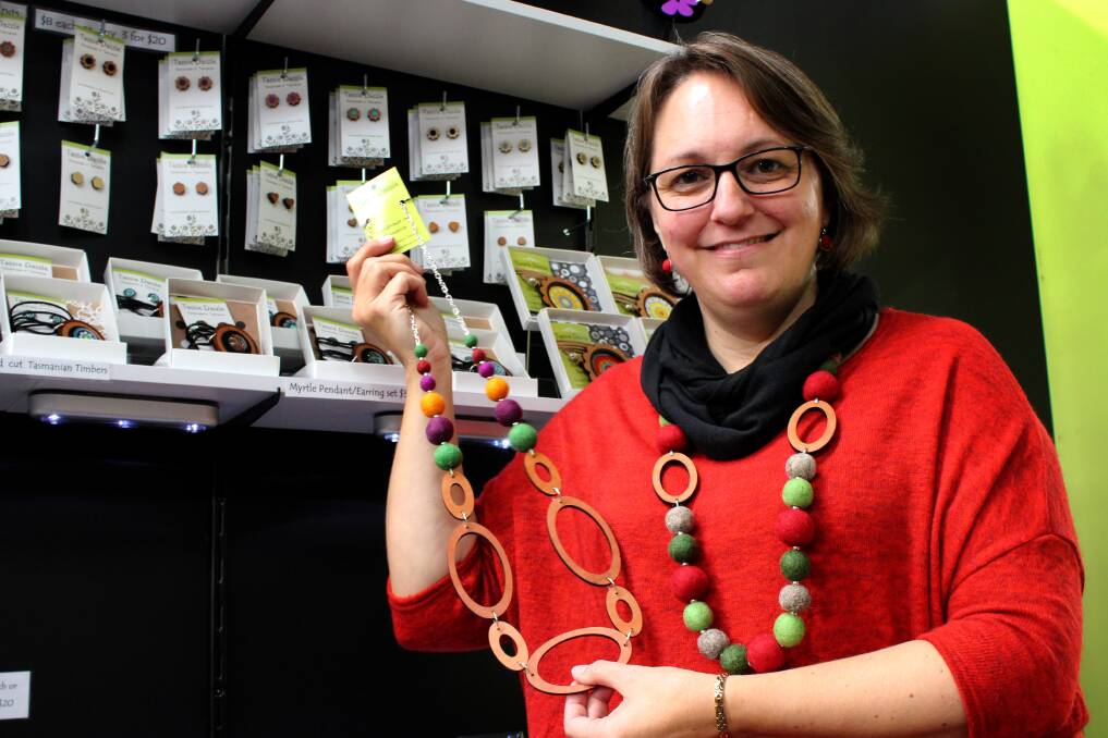 CREATIVE SPARK: Tassie Dazzle designer Toni Pedersen displays a homemade necklace at Agfest earlier this month. Picture: Hamish Geale 