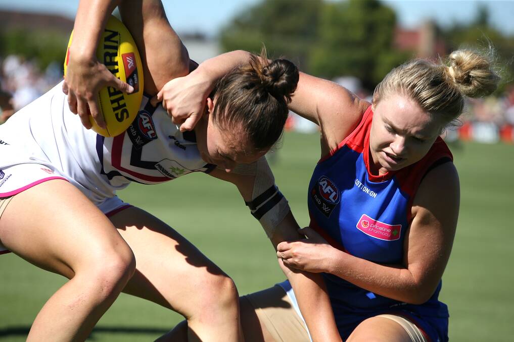 WRAPPED UP: Daria Bannister lays a tackle on Fremantle's Ebony Antonio in her sole game for the Bulldogs this season. Picture: Wayne Ludbey