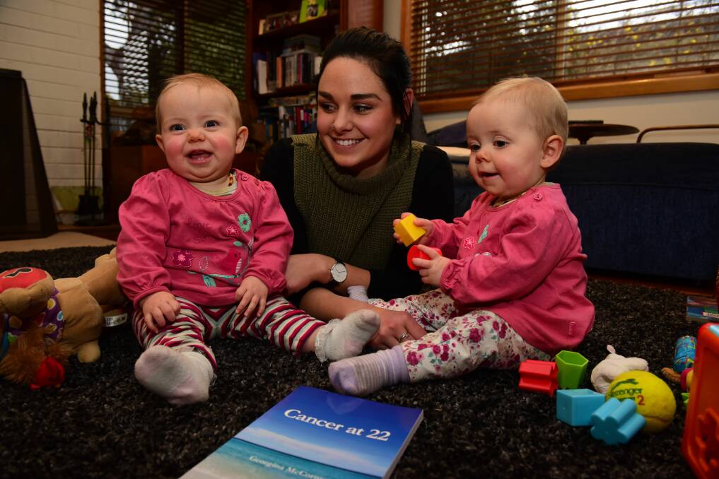 AUTHOR: Launceston's Georgina McCormack and her twin 10-month-old daughters Ruby and Grace. The 25-year-old has written a book detailing her battle with cancer. Pictures: Paul Scambler 