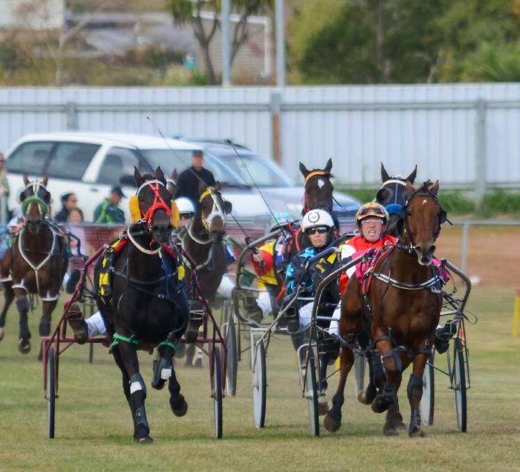 PHOTO FINISH: Le Premiere, driven by jockey Gareth Rattray, and Chief Destroyer, driven by Rohan Hillier, fight it out down the final straight of the St Marys Cup. Picture: Phillip Biggs