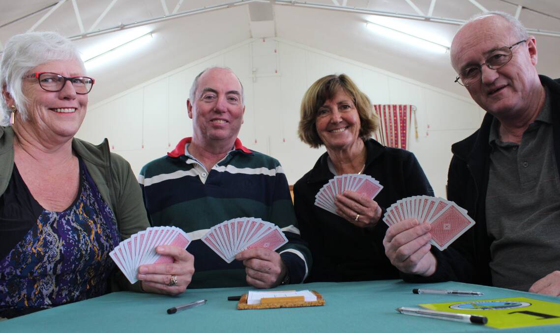 ALL HANDS ON DECK: The Tamar Bridge Club's treasurer Cath Wyllie, tutor Roger Swain, Phillipa Pitt and president David Wyllie are looking to bring new blood into the club. Picture: Hamish Geale 