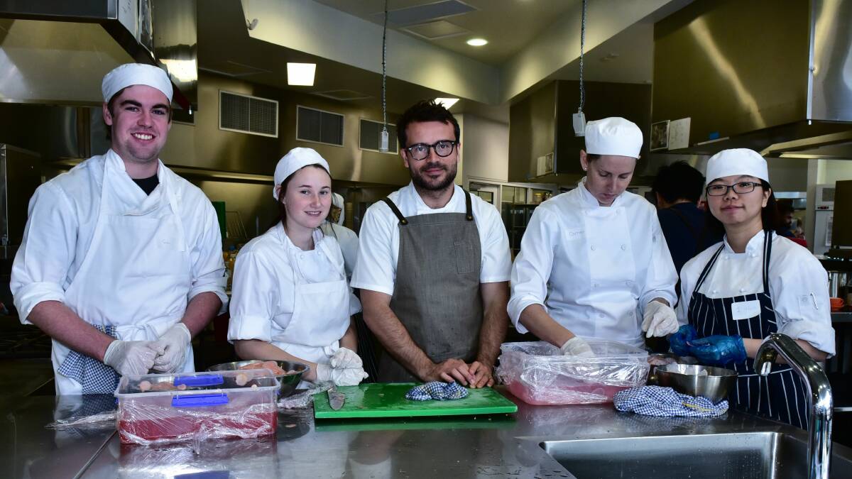 CHEF CHIEF: Danish chef Christian Puglisi (centre) works alongside Drysdale students Sam Gibson, Elisha Glover, Carmen Scott and I-Hung Wu.