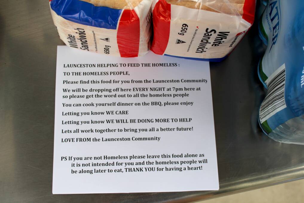 HELPING HAND: A note accompanying the donations of food and water at Royal Park.
